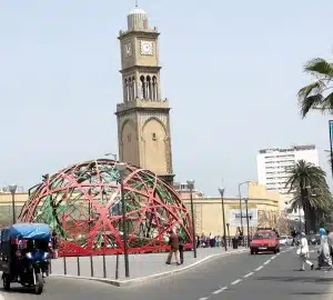 red ornamentation in foreground, mosque in background