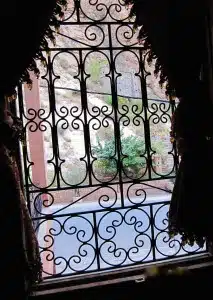 view of outside through curtained and iron window - dades gorges