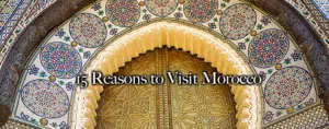An arch with intricate Moroccan architecture with traditional geometric patterns and detailed carvings, representing cultural heritage that you will explore on our tours.