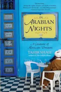 The book cover of Arabian Nights: A Caraven of Moroccan Dreams by Tahir Shah, a useful reading on Morocco and its culture