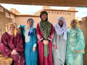 The team of Open Doors Morocco smiling and posing in front of the camera, ready to welcome you on their custom-made and shared tours of Morocco