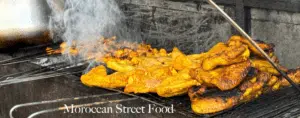 Street vendor preparing a traditional Moroccan tagine, showcasing the vibrant street food culture in Morocco.