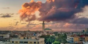 the Hassan Mosque dominating the horizon with dramatic clouds in the background