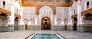Choosing the right time of the day is essential in Morocco travel photography. In this picture, the author has chosen to soft light of the late afternoon that throws beautiful shadows over the intricately decorated interiors of the Madersa University in Marrakech