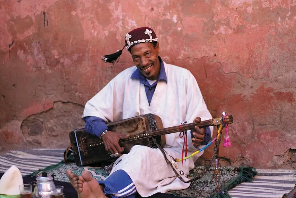 A berber street musician playing traditional music during the Amazigh New Year, known as Yennayer, in Morocco.