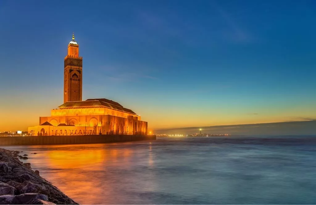 The Hassan II Mosque on the coast of Casablanca lighted up at night for the New Year's celebrations in Morocco.