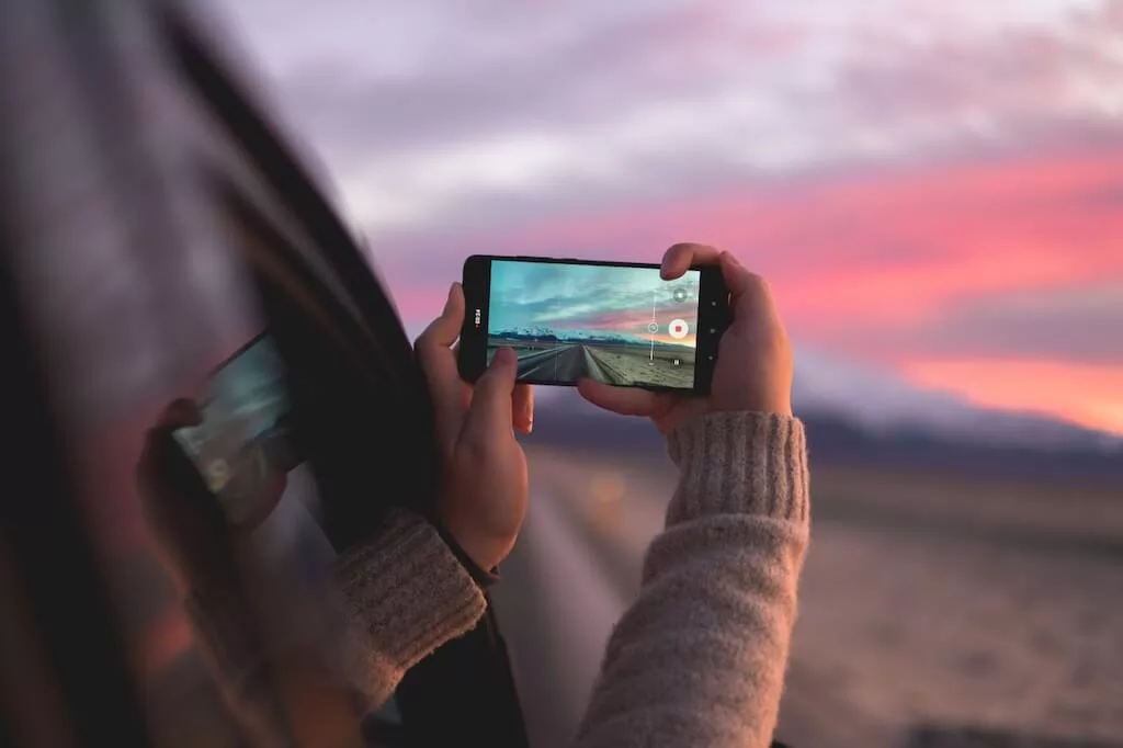 Phone usage in Morocco includes taking pictures of beautiful sunsets while on the road between destinations and being able to share them with your family and friends instantly.