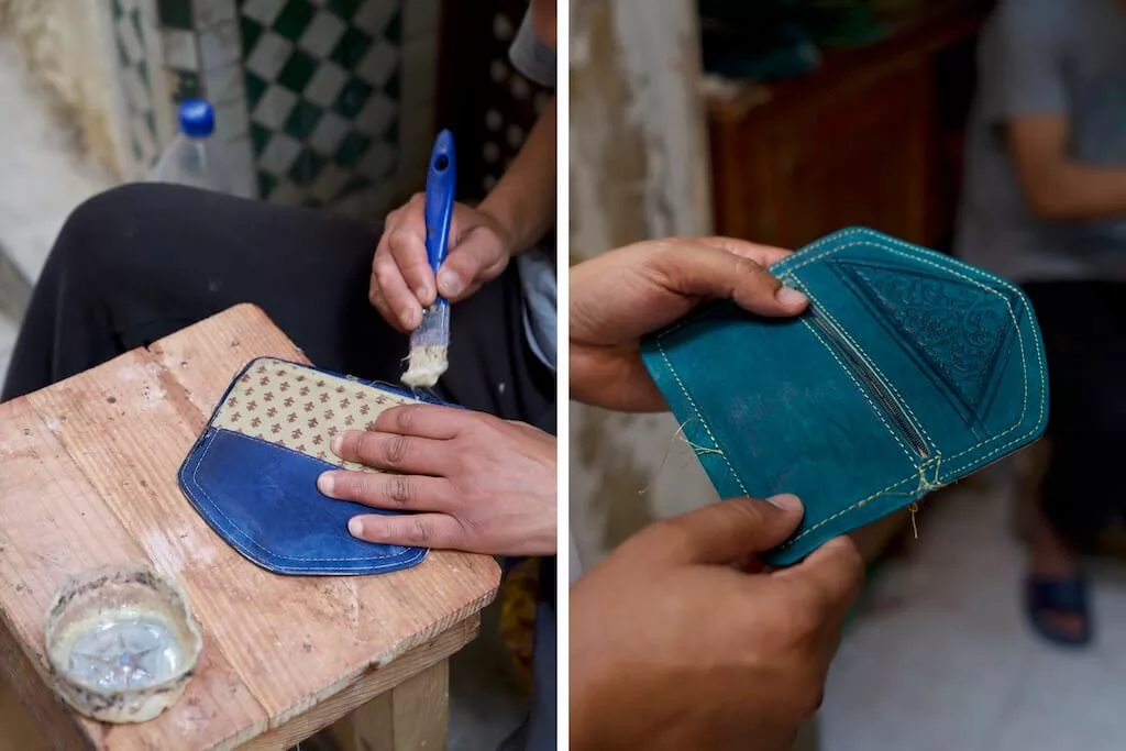A local Moroccan artisan in the act of making a handmade leather wallet in his tiny shop at the markets in Morocco.