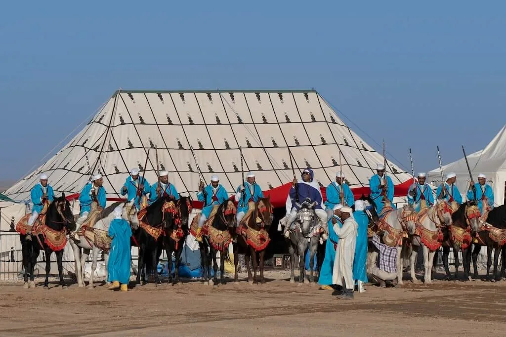 A typical scene from the Festival Fantasia in Morocco - men in traditional clothing on horseback, ready to start the show.