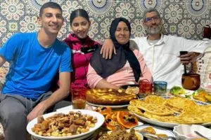 A local family sharing iftar with their guests to show them the famous Moroccan hospitality.