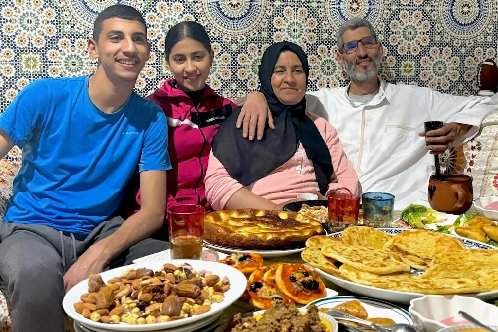 A local family sharing iftar with their guests to show them the famous Moroccan hospitality.